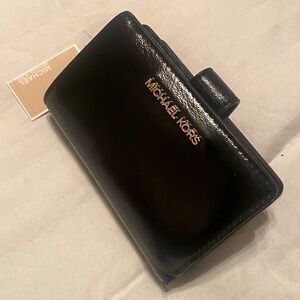 Michael Kors black wallet snap front card storage and coin/cash area